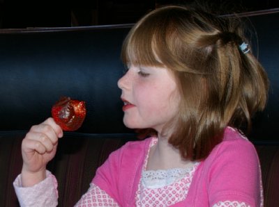 Granddaughter Laci eating a strawberry at Shenanigans restaurant in Tacoma.