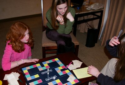 Bailee, Caitlin, and Daron playing Pictionary - photo.