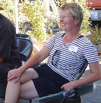 Debbie relaxing under a canopy by the barbeque.