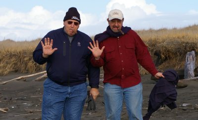 Rob and Donn on the beach with cigars - Ocean Shores Washington Adventure.