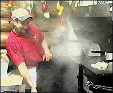 Owner and chef Gary Kurashima cooking at the Warthog Barbeque Pit.