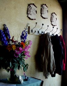 Simple coat hooks and flowers.