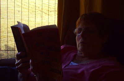 Peg quietly reading at The Queen of the Valley Bed and Breakfast La Conner, Washington - Photo.