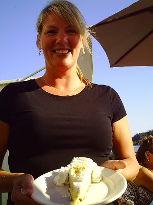 The waitress Sandy serving homemade key lime pie at the Waterfront Cafe in La Conner, Washington - Photo.