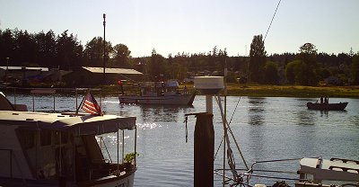 Boat traffic on the channel in downtown La Conner, Washington - Photo.