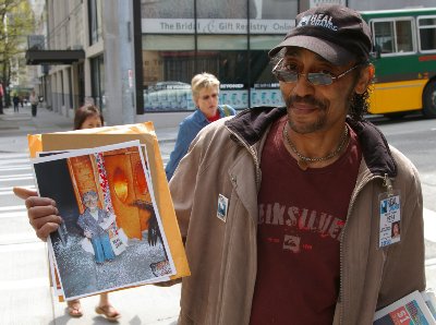 Calvin Turner selling Changing Times on the corner in Seattle outside the Dahlia Lounge.