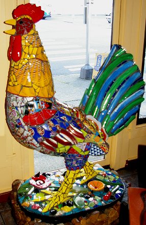 A giant mosaic rooster gruards an emergency exit at the Palace Chicken . . . oops, Kitchen.