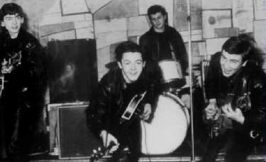 A photograph of the early Beatles featuring George Harrison, Paul McCartney, John Lennon and Pete Best - Photo.