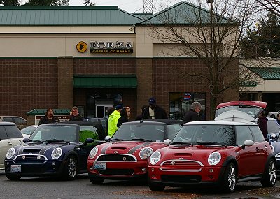 A Mini-Cooper gathering in the rain at a parking lot in Tacoma, Washington - Photo.