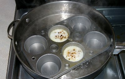 Poaching Eggs in a miffun tin.