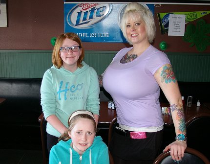 Waitress Sarah with our two granddaughers at Ricky J's sports bar and restaurant - image.