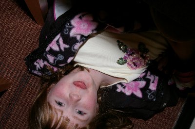 Laci looking up from underneath the chair at the CenterStage Theatre in Federal Way, Washington - Photo.