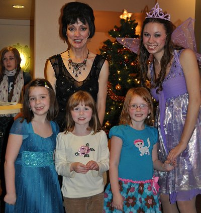 Three princesses with a fourth looking on at the CenterStage Theatre in Federal Way, Washington - Photo.