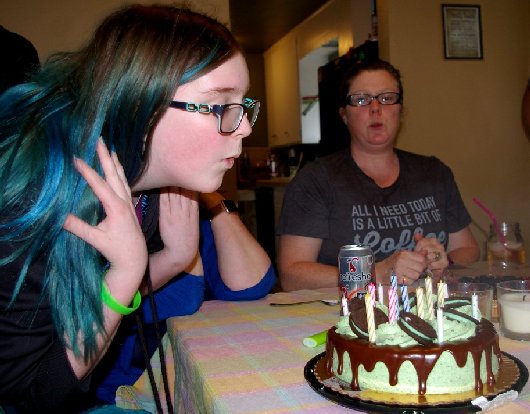 Bella Doman blowing out candles on her birthday cake in Tacoma, Washington - image.
