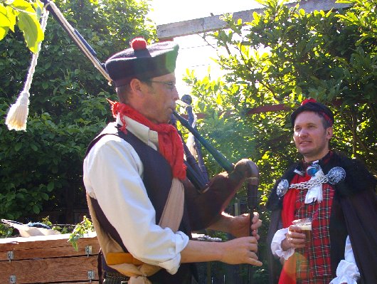 Kilted piper welcoming the visitors for Bard in the Yard, Washington - image.