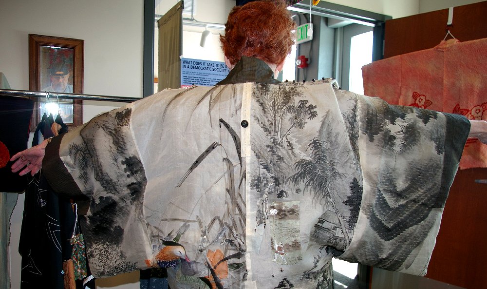 Peg Doman trying on a kimono in Tacoma, Washington.