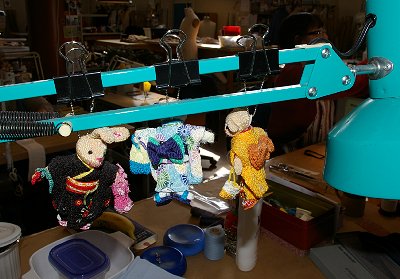 Doll decorations at a seamstress workstation at Seattle Opera.