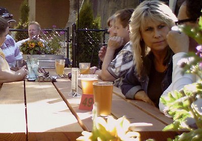 Sturdy tables with flowers on them at The Harmon Tap Room - photo.