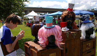 Colorful heads, wigs, and hats at the Urban Art Festival 2011.