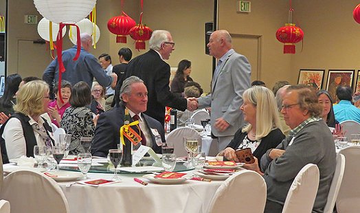 Friends Ron Lunceford and Mike Dunlap greeted each other at the Chinese Reconciliation Foundation Project Dinner in Tacoma - image.