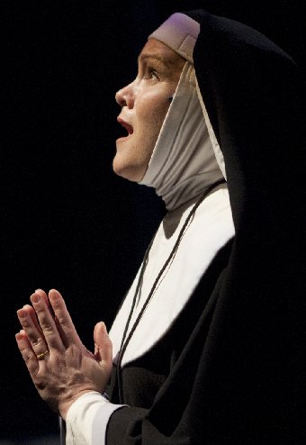Alais, played by Caitlin Frances, praying for guidance in Cardinal Sins - image