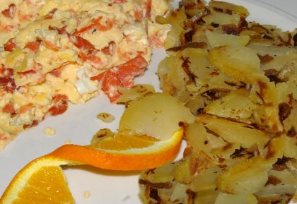 Scrambled eggs with salmon and breakfast potatoes from the Chanterelle Restaurant in Edmonds, Washington - image.