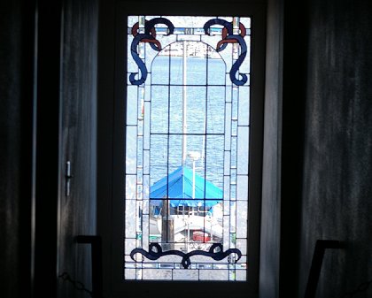 The stained glass window from inside the MarketPlace Grille in Gig Harbor, Washington - image.
