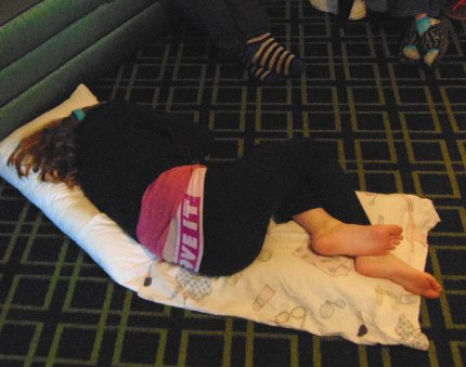 Granddaughter Laci asleep on the floor at the Fairfield Inn in downtown Puyallup, Washington.