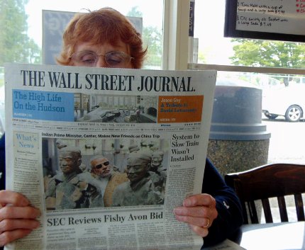 Peg Doman reading the Wall Street Journal at Don's Drive-In in Puyallup, Washington.
