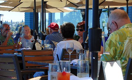 People on the deck at the Lobster Shop enjoying the view, the 90 degree weather AND the cool breezes of Puget Sound - image.