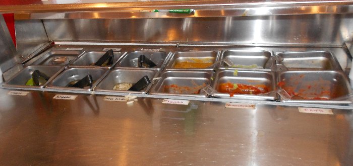 The condiment station at Los Tamales Restaurant Tacoma - image.