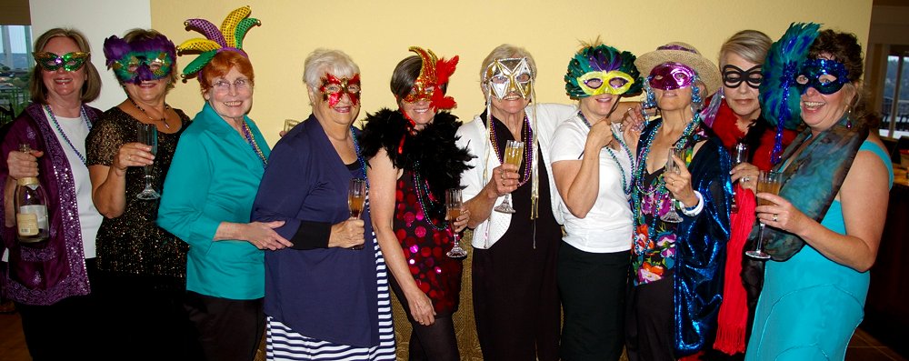 Local ladies enjoying a Mardi Gras dinner from FISH Food Banks - image.