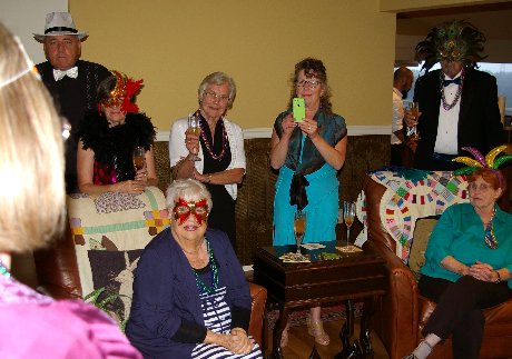 People being welcomed to the Mardi Gras Dinner Event - image.