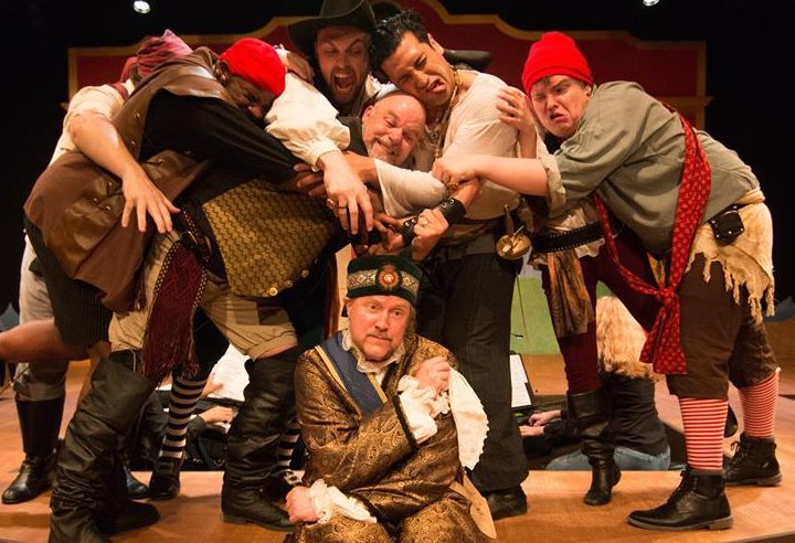 The pirate crew and Major General Stanley (Gary Chambers) in The Pirates of Penzance at Lakewood Playhouse - PHOTO by TIM JOHNSTON - image.