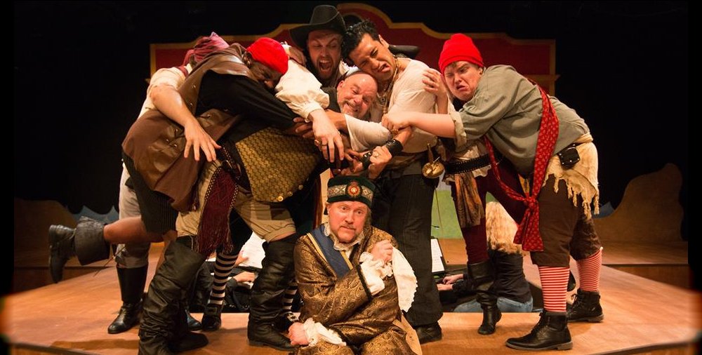 Most of the pirate crew and Gary Chambers as the Major General from the Lakewood Playhouse Production of The Pirates of Penzance - PHOTO by TIM JOHNSTON - image.