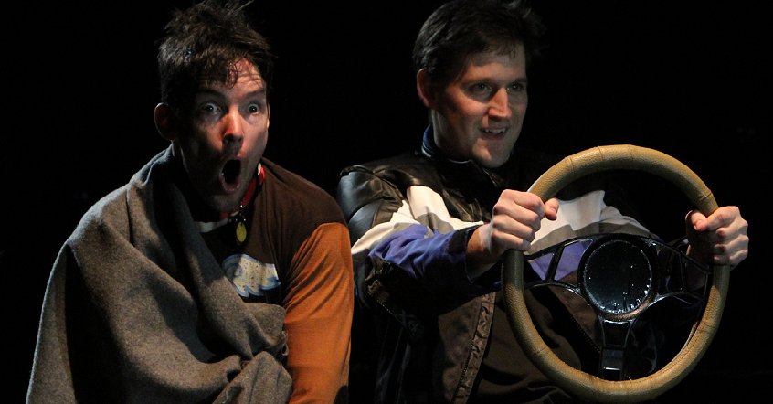 Enzo and Denny speeding in The Art of Racing in the Rain at Book-It Theatre in Seattle, Washington. Photo by Alan Alabastro.