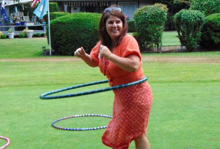 Hula hooping at the Tacoma Executives Association Golf Tournament in Tacoma, Washington - image.